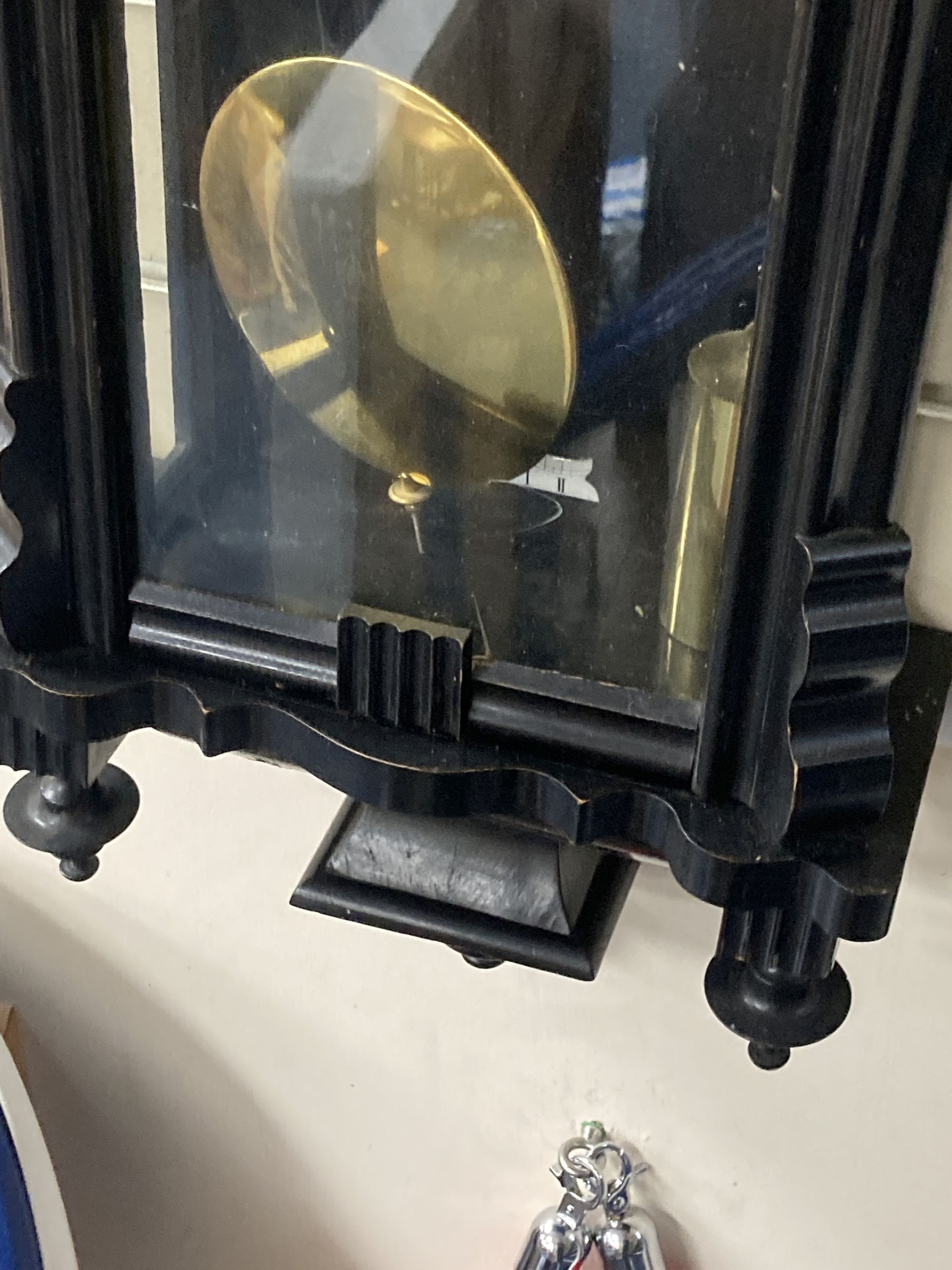 An early 20th century ebonised Vienna wall clock, height 106cm